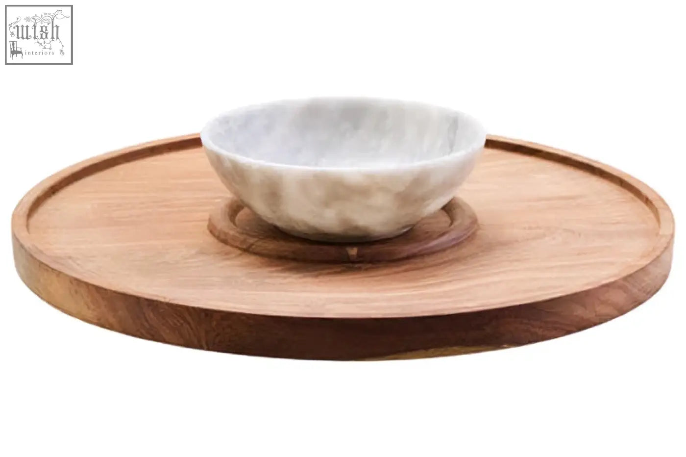 A white marble chip bowl with gray veining on a kora acacia wood circular serving tray for chip and dip use
