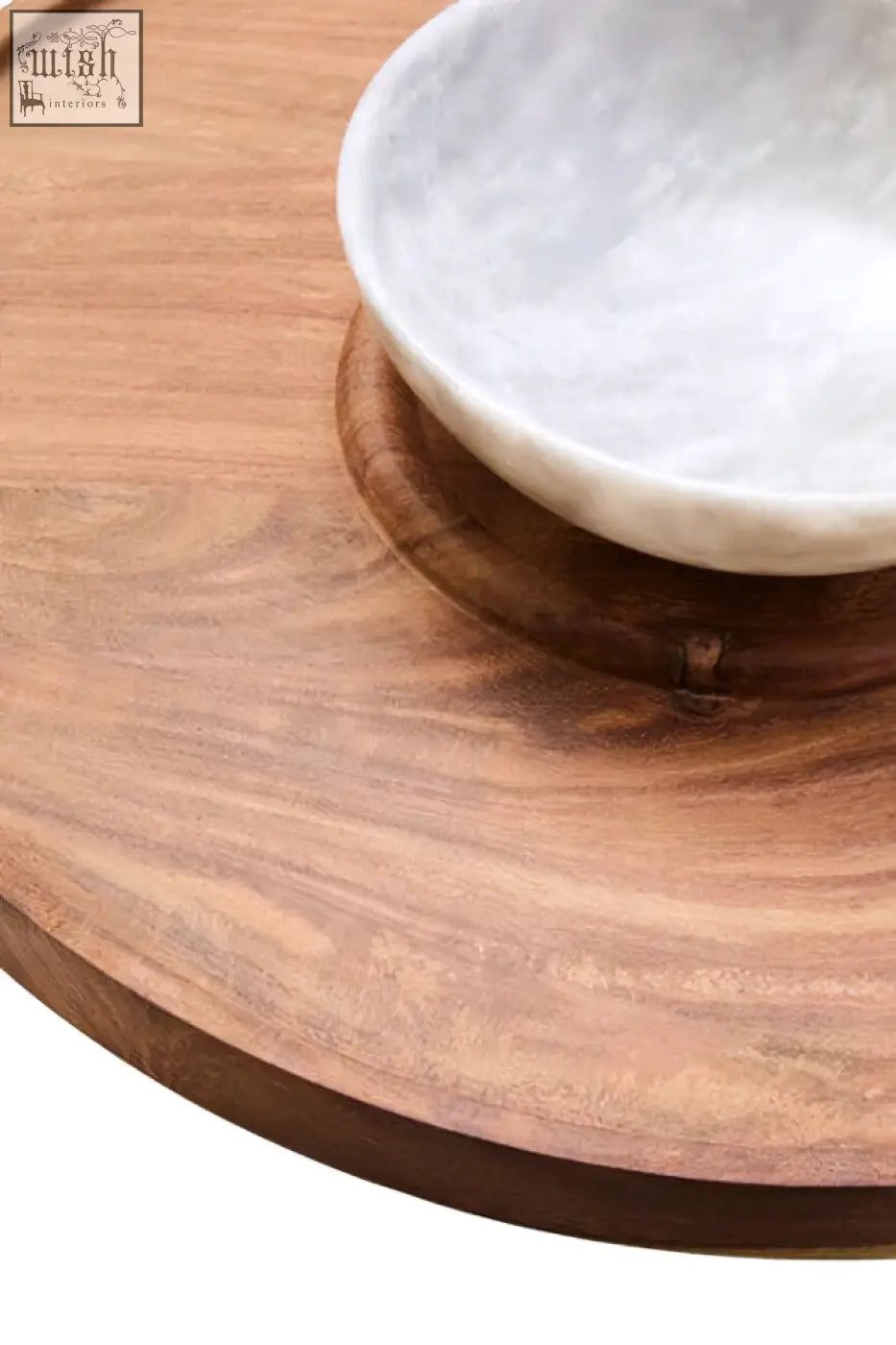 A white marble chip bowl resting on a dark kora acacia wood circular tray for serving snacks or dips