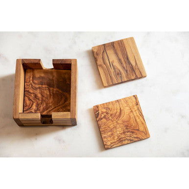 Natural olive wood square coasters with rich swirling grain and warm brown finish from kora set of 4
