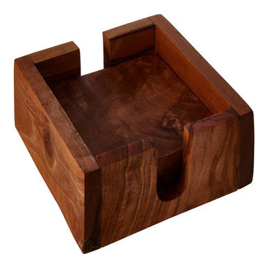 A square wooden coaster holder with a rich dark brown finish holding olive wood square coasters from the kora set