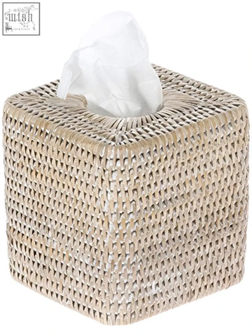 Beige woven rattan tissue box cover with white paper towel partially pulled out for stylish tissue box use