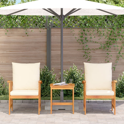 Beige cushioned wooden patio chair set with matching side table under white umbrella made of solid acacia wood