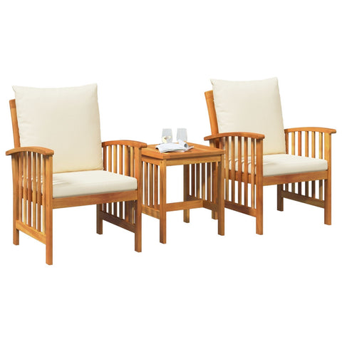 Set of two light wood armchairs with cream cushions and slatted side table in solid acacia wood outdoor dining set