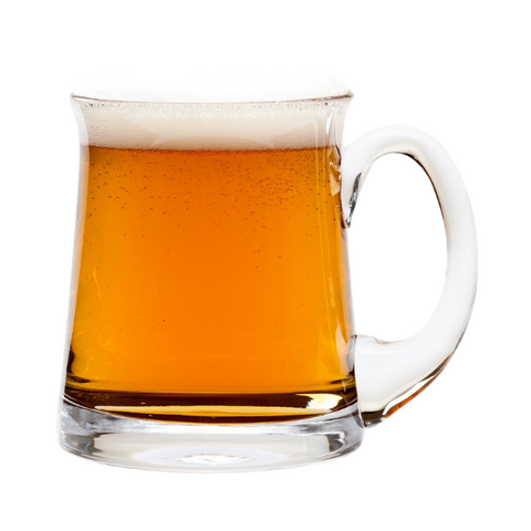 Clear glass krosno aleman tankard pint filled with amber tradewinds beer and frothy white head beer tankard
