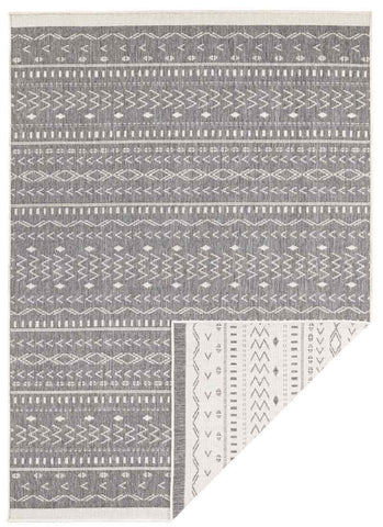 Gray and white geometric-patterned kuba reversible indoor-outdoor rug with a woven texture for versatile use