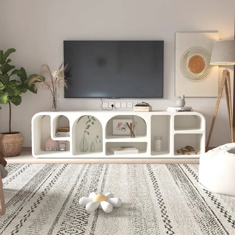 White modern media console with curved cutouts and open shelving in the kure cabinet design