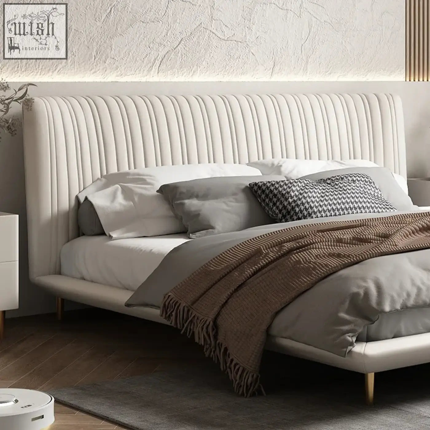 Cream-colored kuri bed with chic comfort featuring vertical channelling and slender wooden legs in tufted upholstery