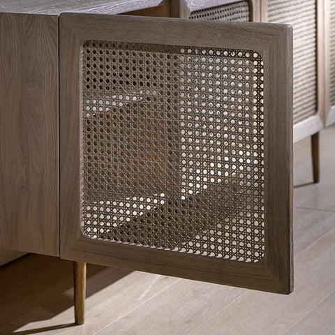 Gray wood-framed kyoto cabinet door with a woven cane panel showing natural texture and design detail