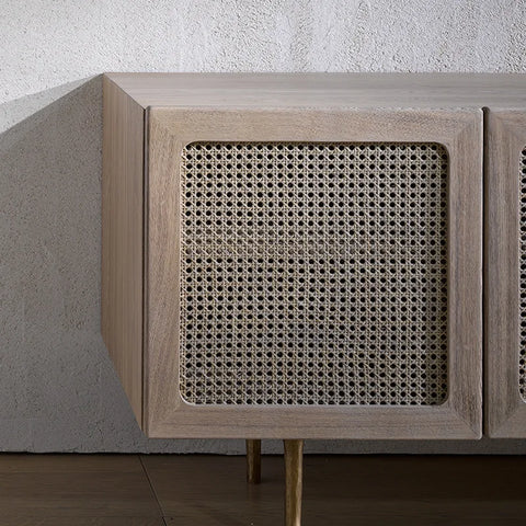 Light gray wood kyoto cabinet with woven cane panel doors and slender gold legs for stylish storage