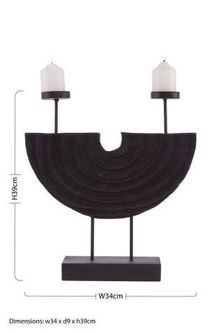 Black textured semi-circular lacuna two candle holder with two slender arms holding white candles