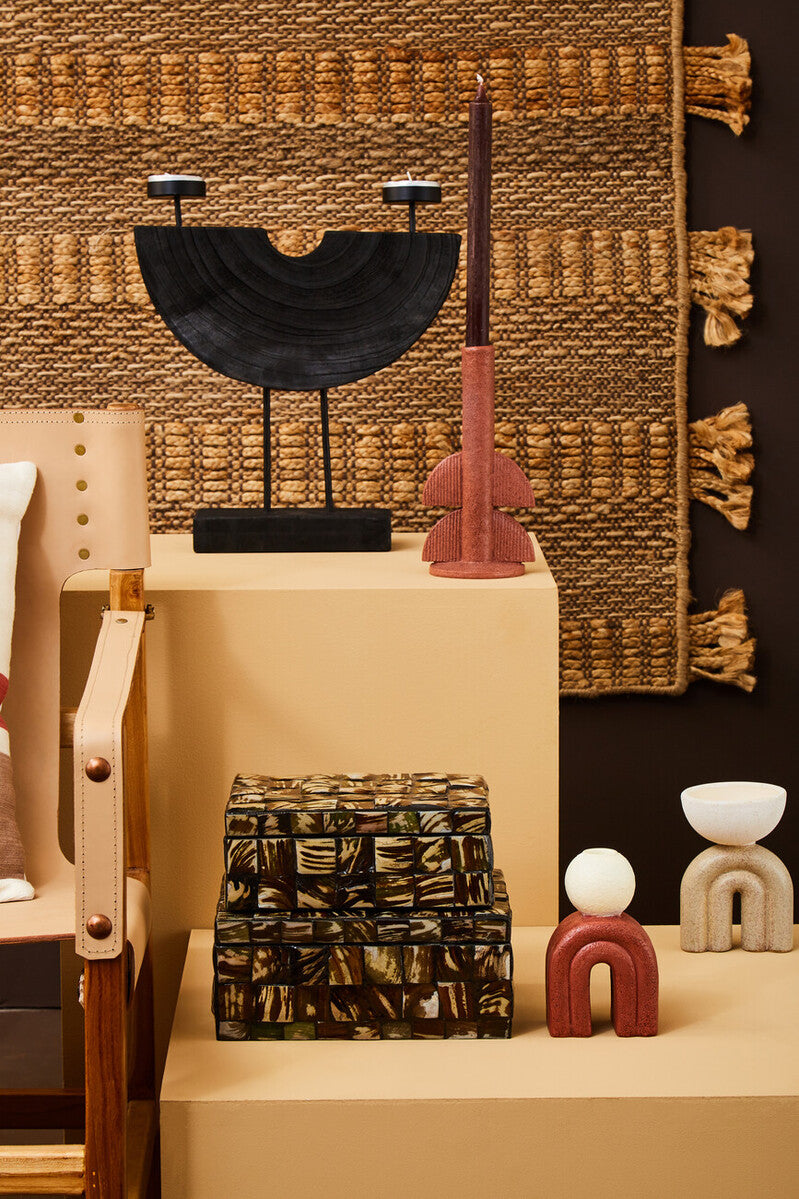 Lacuna two candle holder with black matte semi circular design and two small candle holders on thin legs