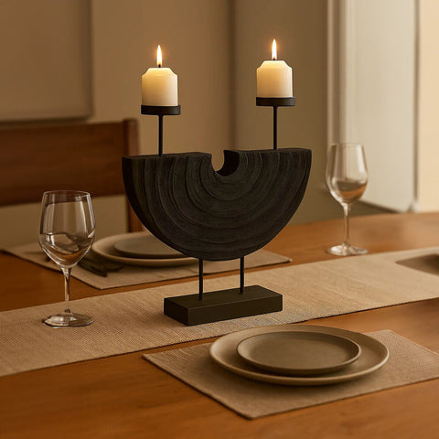 Black wooden two candle holder with two lit white candles perfect for cozy home decor