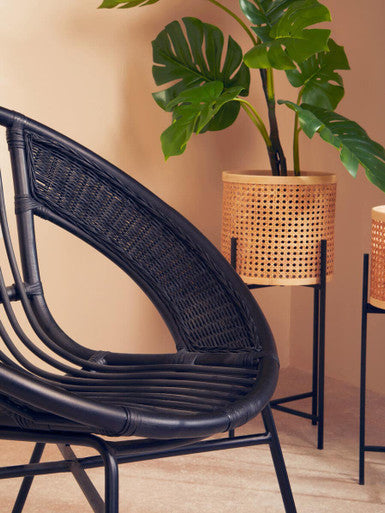 Lagom black natural rattan and iron black chair with curved back and sturdy metal frame in black natural rattan design