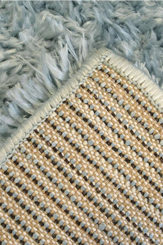 Light blue shaggy rug with woven beige and brown backing in duck egg blue perfect for cozy decor