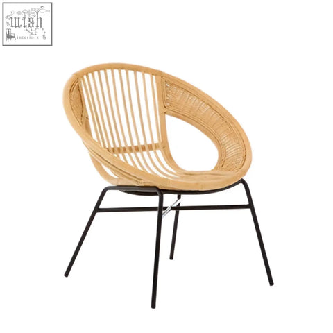 Lagom natural rattan chair with a natural woven seat and sleek black iron chair frame for stylish seating