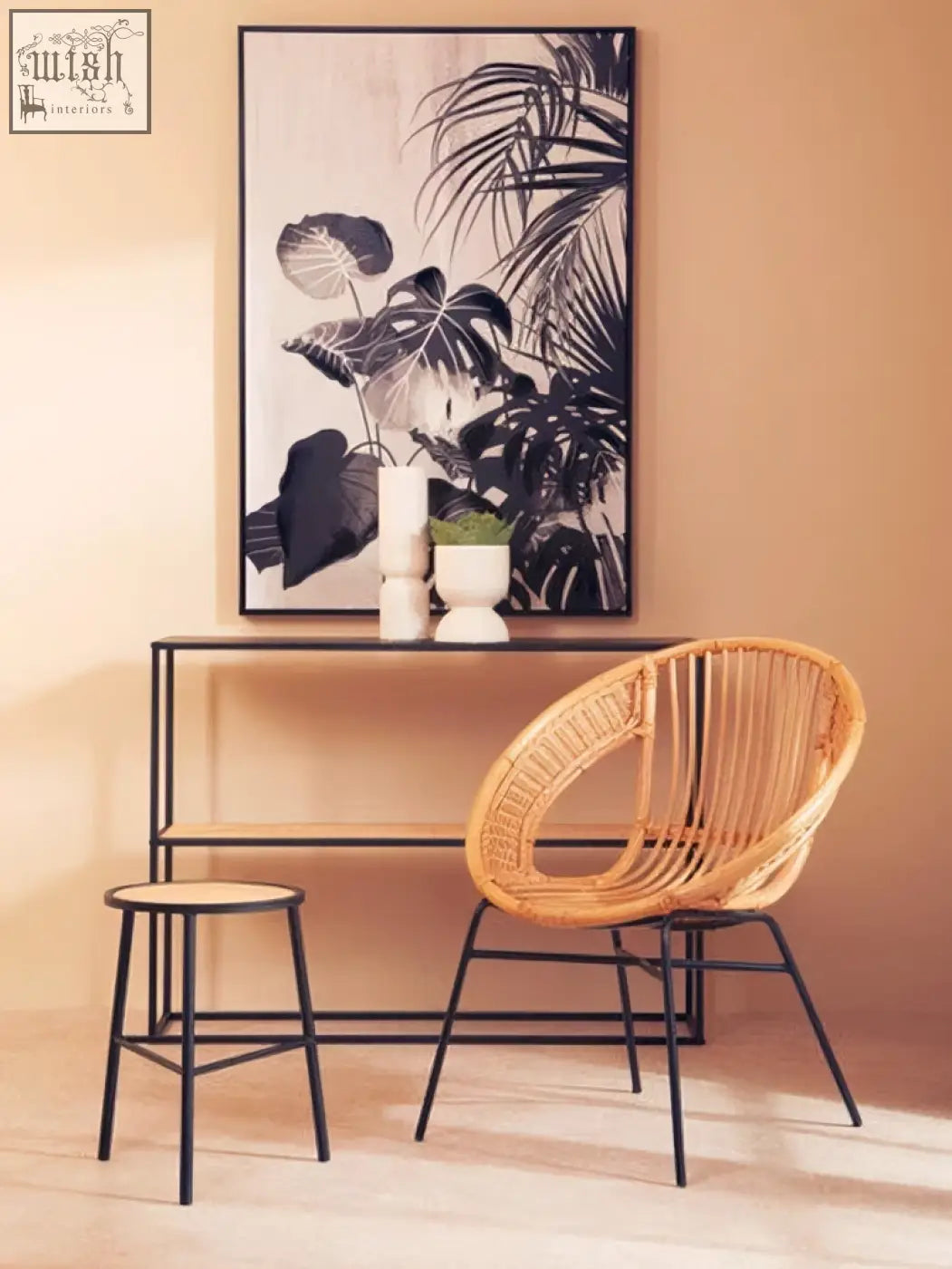 Lagom natural rattan chair with woven seat and black iron frame for stylish indoor or outdoor seating