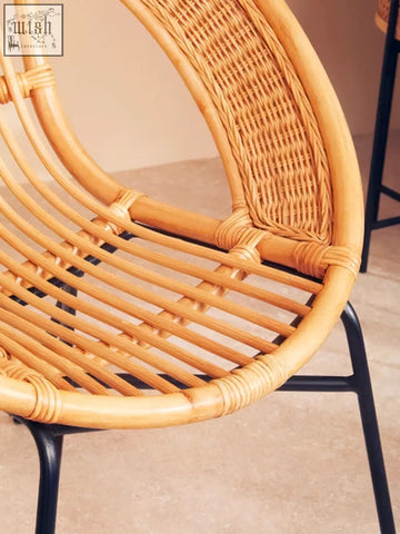 Lagom natural rattan chair with curved natural frame and black iron legs perfect black iron chair design