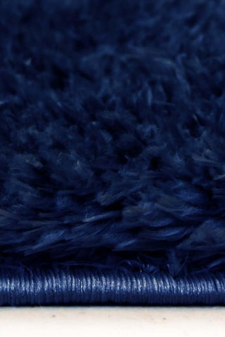 Lagom navy shaggy rug with deep navy blue plush shag texture and tightly woven edge for cozy spaces