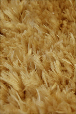 A plush golden-brown lagom ochre shaggy rug with dense fluffy texture perfect for cozy home decor