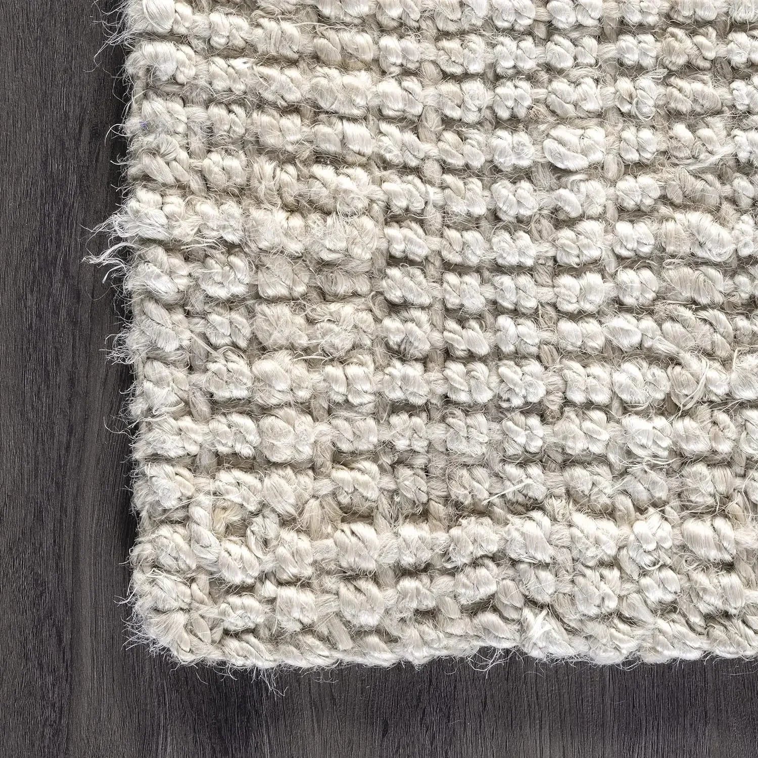 Beige lamion rug with a textured braided pattern and frayed edges perfect for cozy home decor