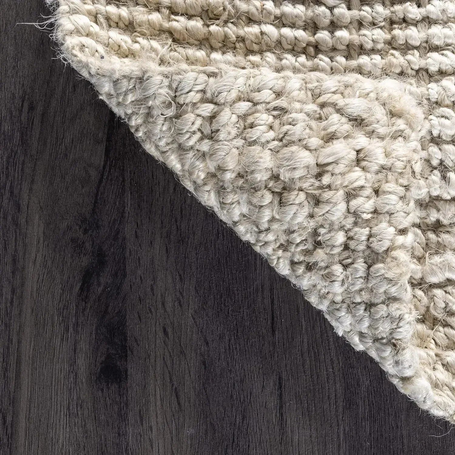 Lamion rug chunky off-white braided handcrafted textured rug on dark wood flooring for cozy living spaces