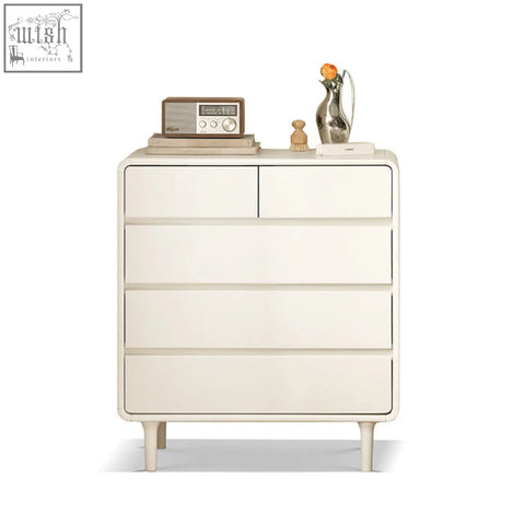 Cream-colored lance cabinet white with minimalist design tapered legs and wood accents in sleek modern style