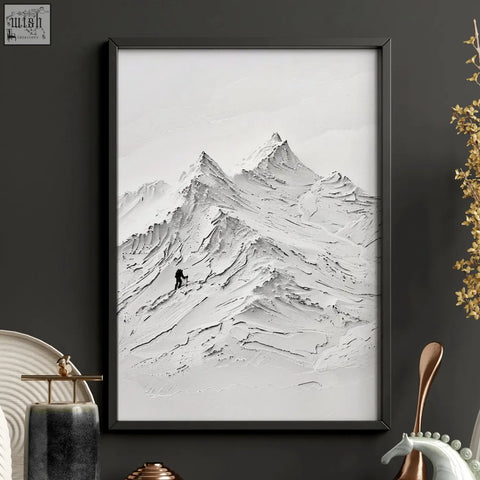 Black-framed landscape art print of textured monochromatic nordic mountain with lone climber for wall art set of 3
