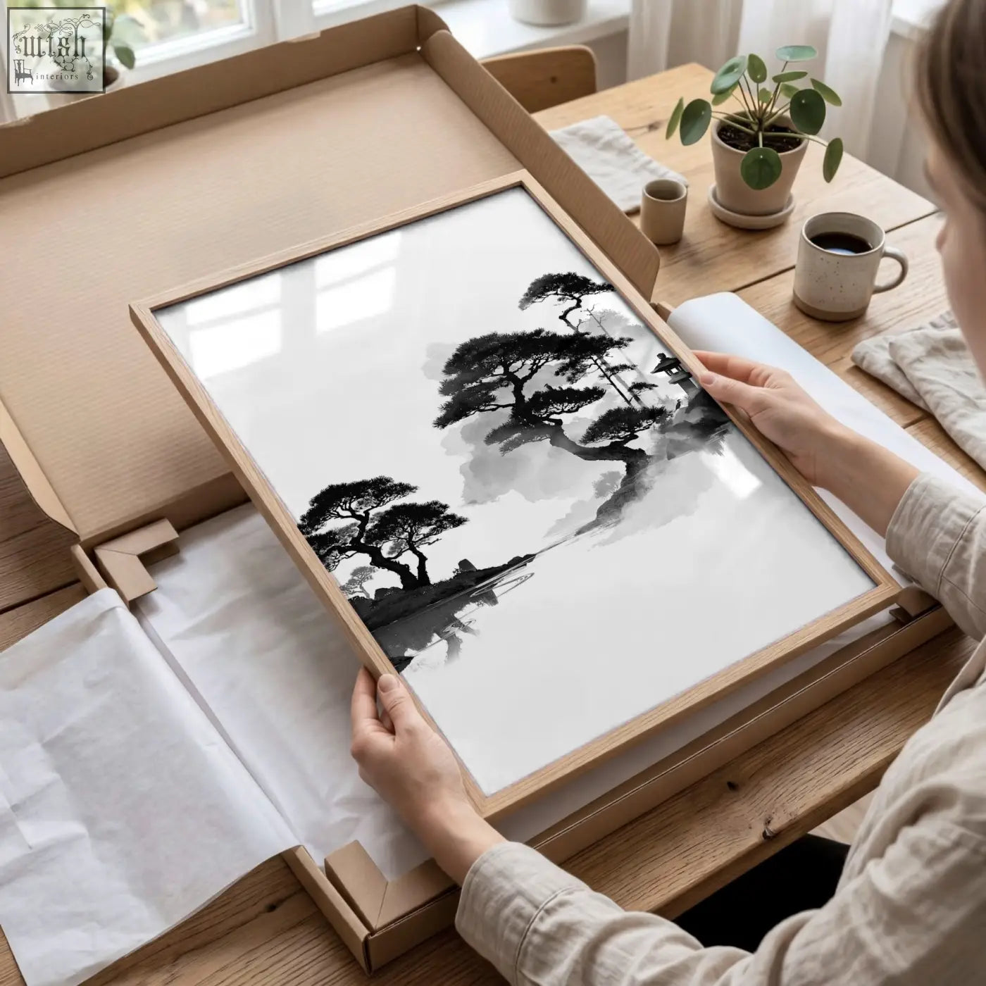 A minimalist black-and-white landscape art painting of pine trees in a wooden frame perfect for dining room decor