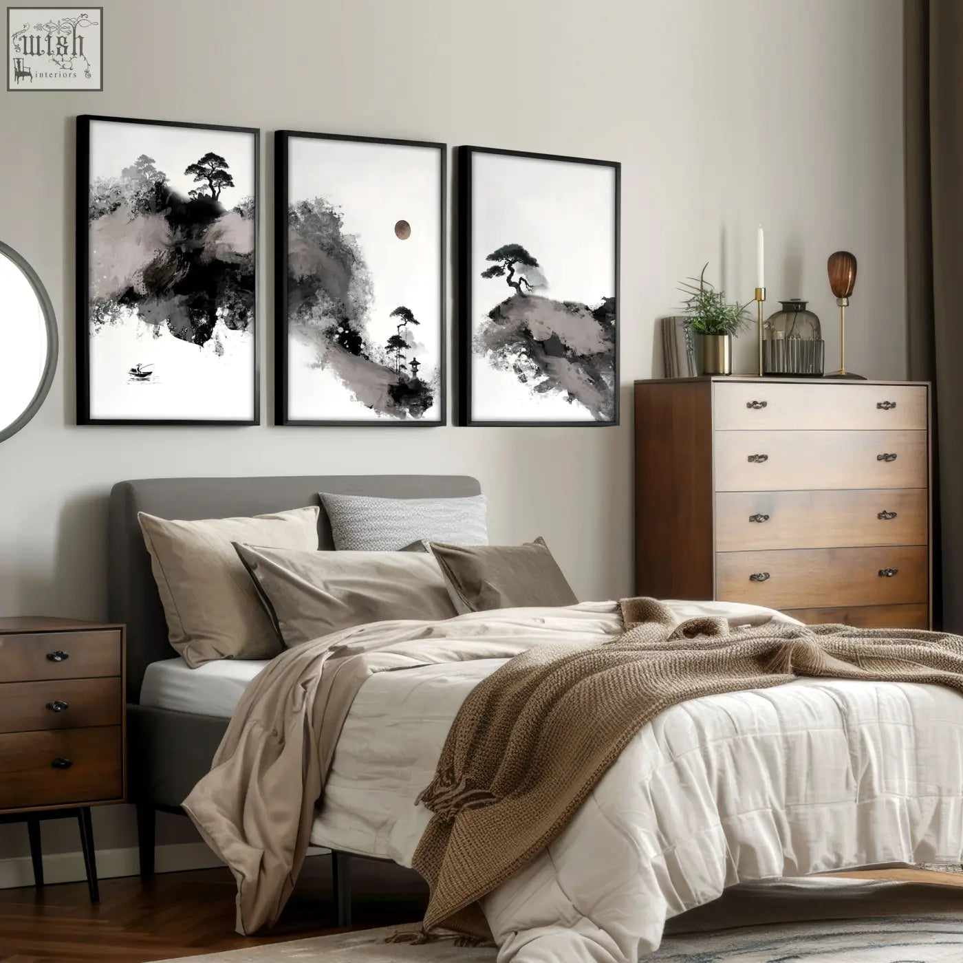 Set of three black and white japanese ink wash landscape prints with maroon moon and pine trees above a modern bed