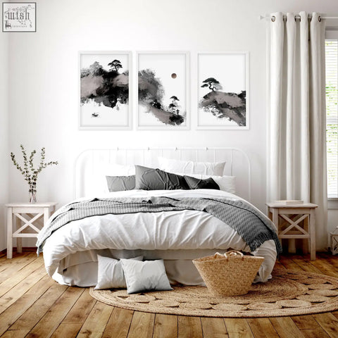 Woven wicker basket with natural tan hue and sturdy handles alongside japanese ink wash landscape print set of 3
