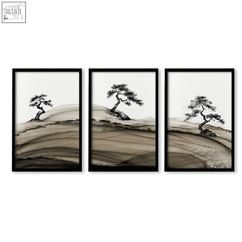 Set of three black-framed minimalist landscape prints japanese featuring ink wash pine trees on rolling hills in brown tones