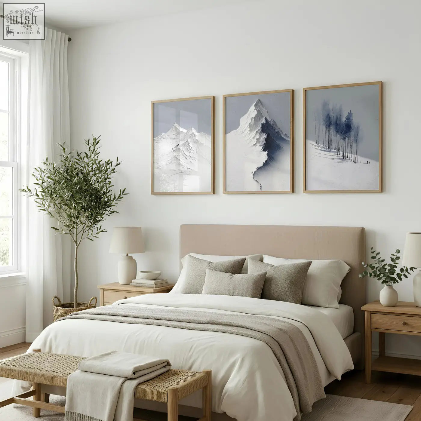 Beige upholstered bed with matching pillows and neutral throw displayed with nordic snow mountains landscape wall art set of 3