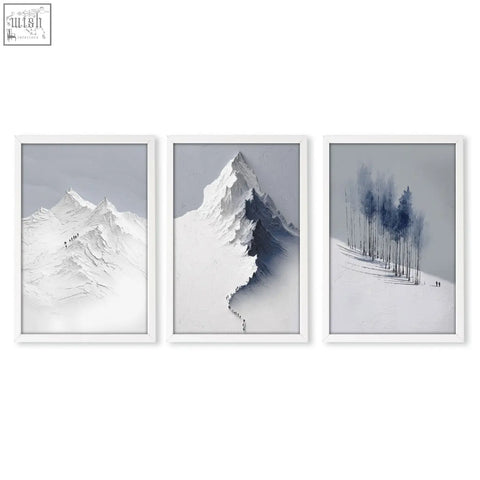 Set of three minimalist white-framed landscape wall art featuring nordic snow mountains and winter forest prints