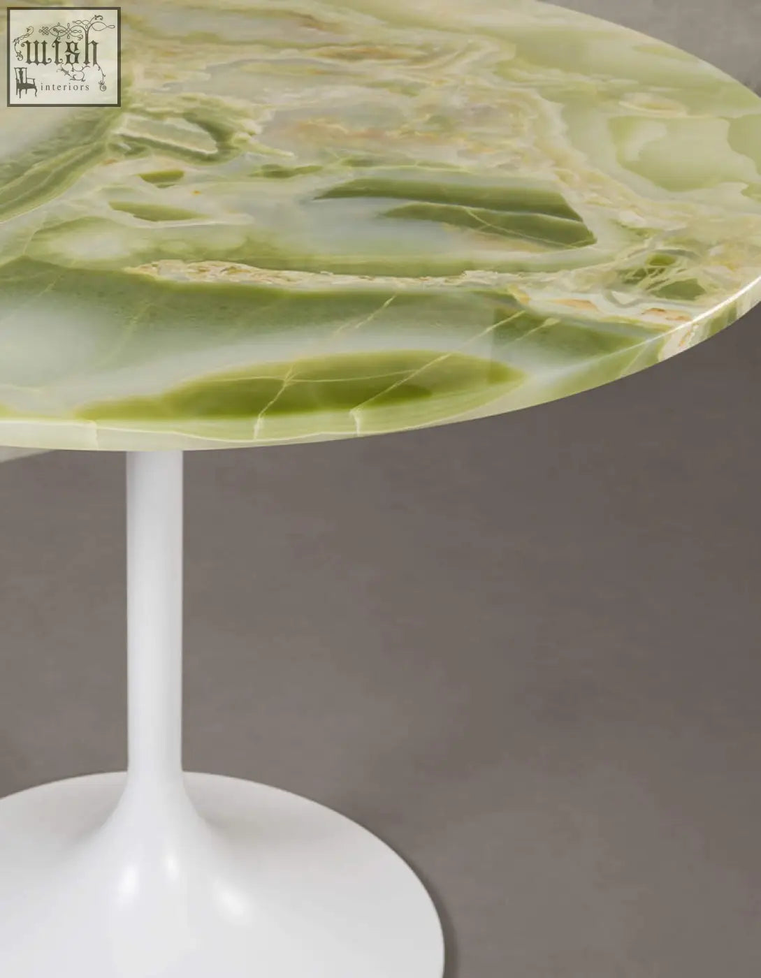 Langenfeld round dining table with a green onyx marble top and white pedestal base perfect for round dining