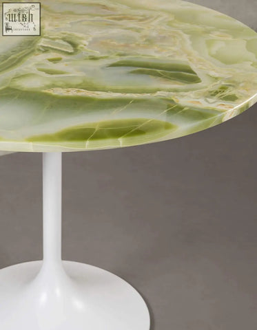 Langenfeld round dining table with a green onyx marble top and white pedestal base perfect for round dining