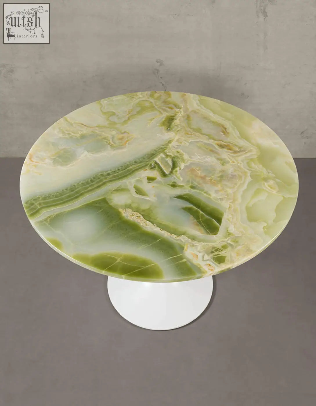 Langenfeld round dining table with polished green onyx marble top and sleek white pedestal base for round dining