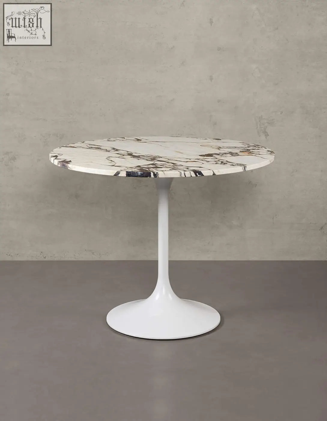 Langenfeld round dining table with white marble top and minimalist pedestal base perfect for round dining spaces