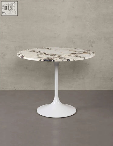 Langenfeld round dining table with white marble top and minimalist pedestal base perfect for round dining spaces