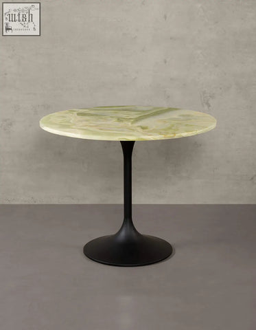 Langenfeld round dining table featuring a pale green marble top and matte black metal pedestal base for round dining