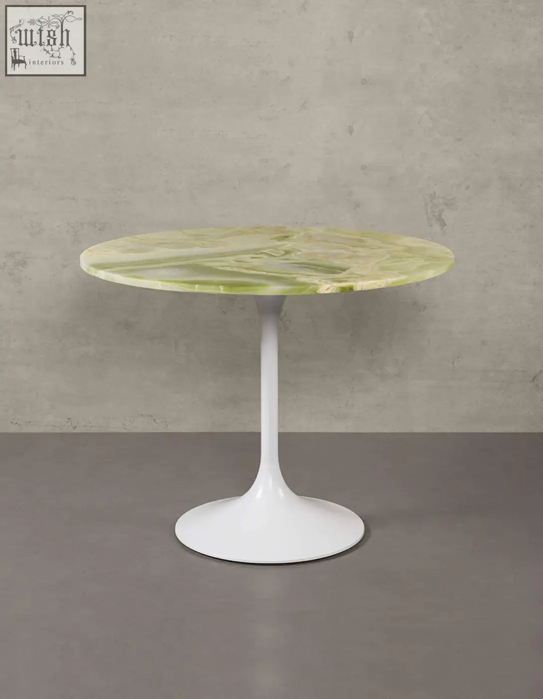Langenfeld round dining table with a sleek green marble top and minimalist white pedestal base for round dining