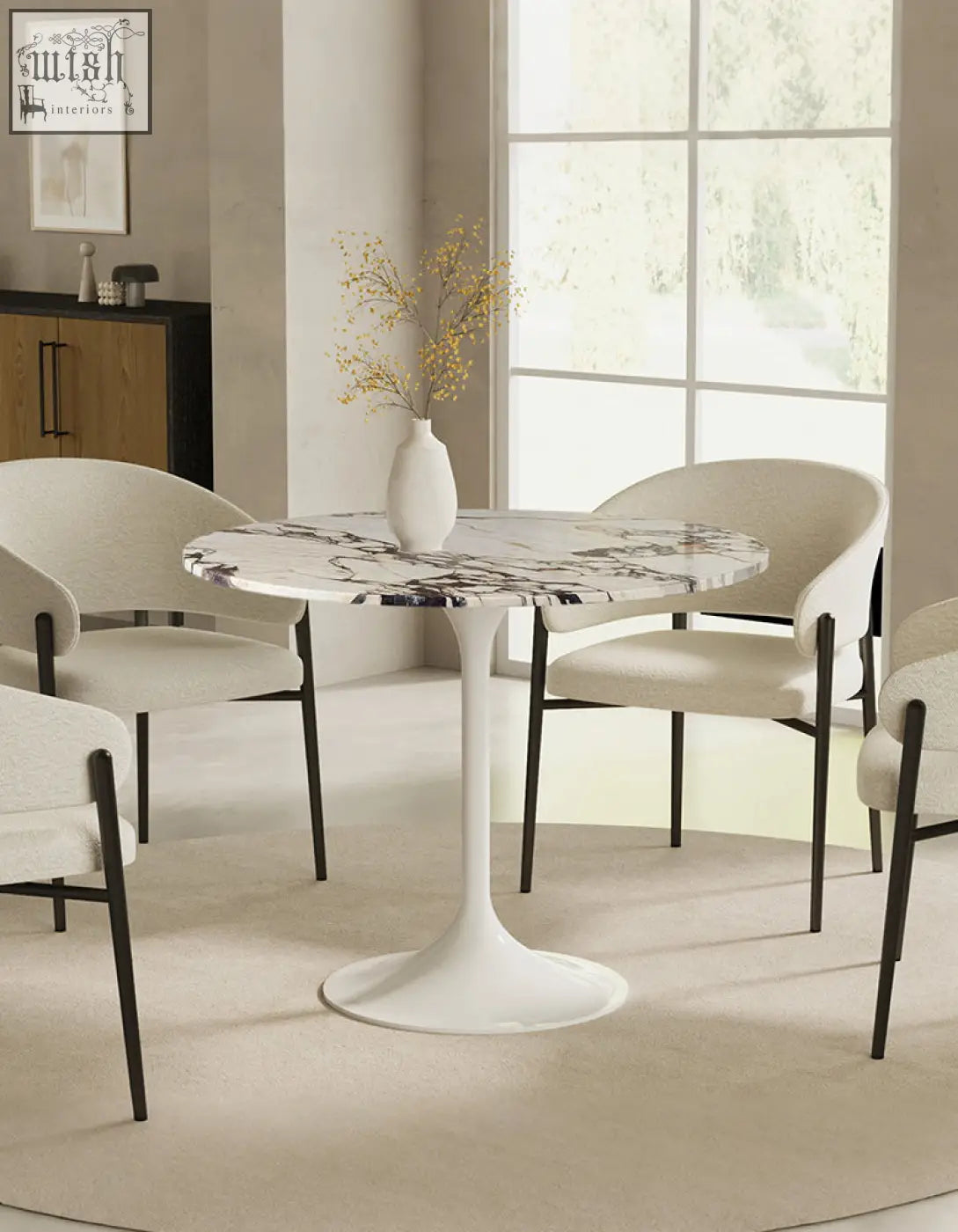 Langenfeld round dining table with white marble top and sleek curved pedestal base perfect for round dining