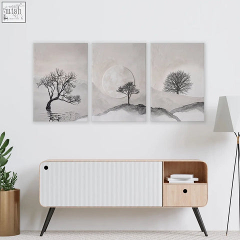 Set of 3 black and white canvas wall art featuring minimalist trees for living room above wooden console table