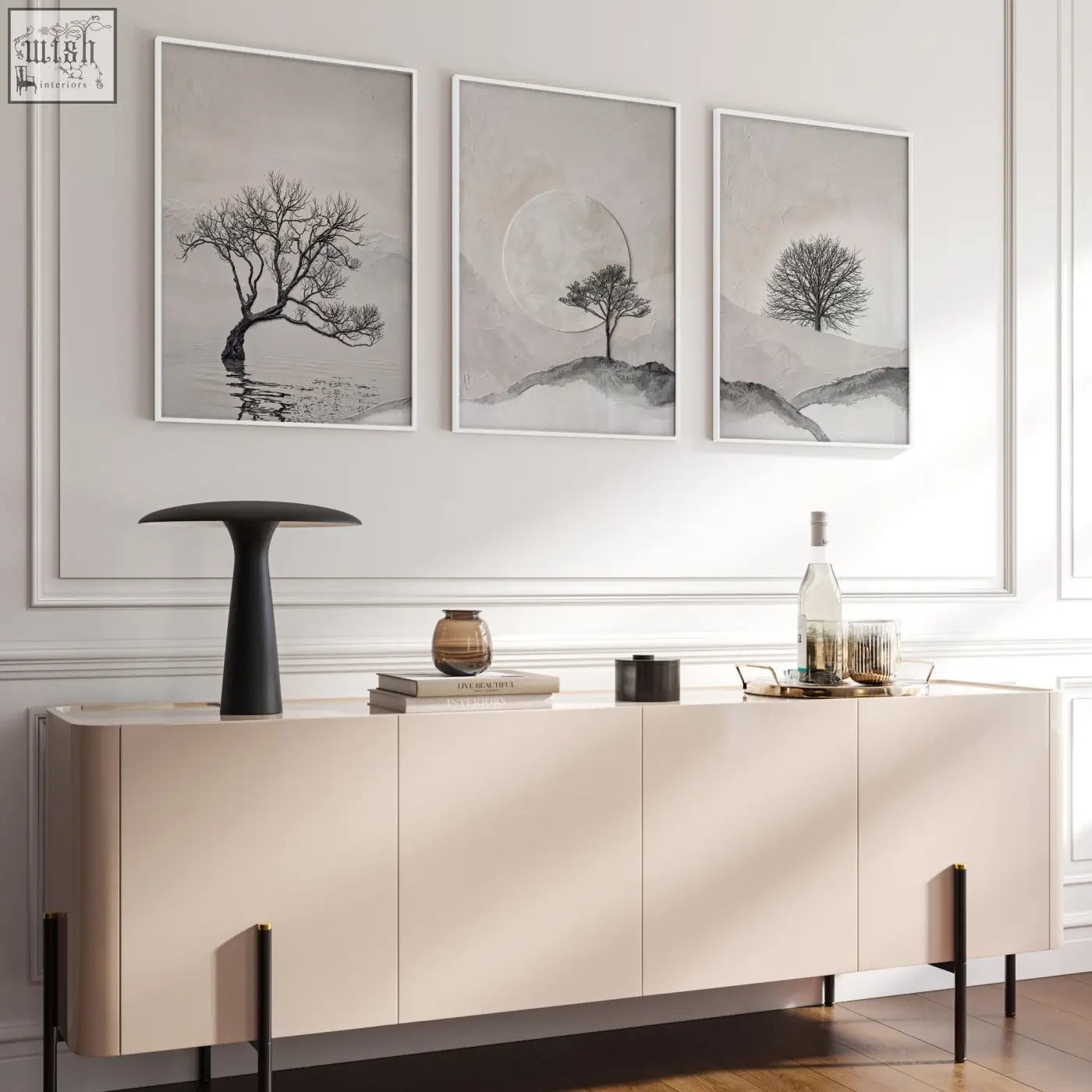 Cream-colored modern sideboard with minimalist design and black legs below large 3 piece wall art for living room