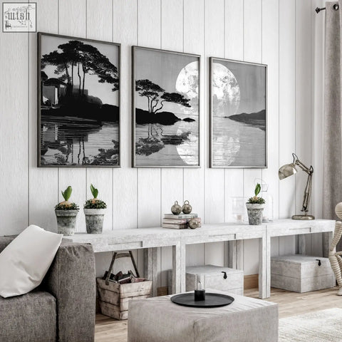 Three framed black and white large art living room prints of japanese moonrise silhouette coastal scenes with trees and water