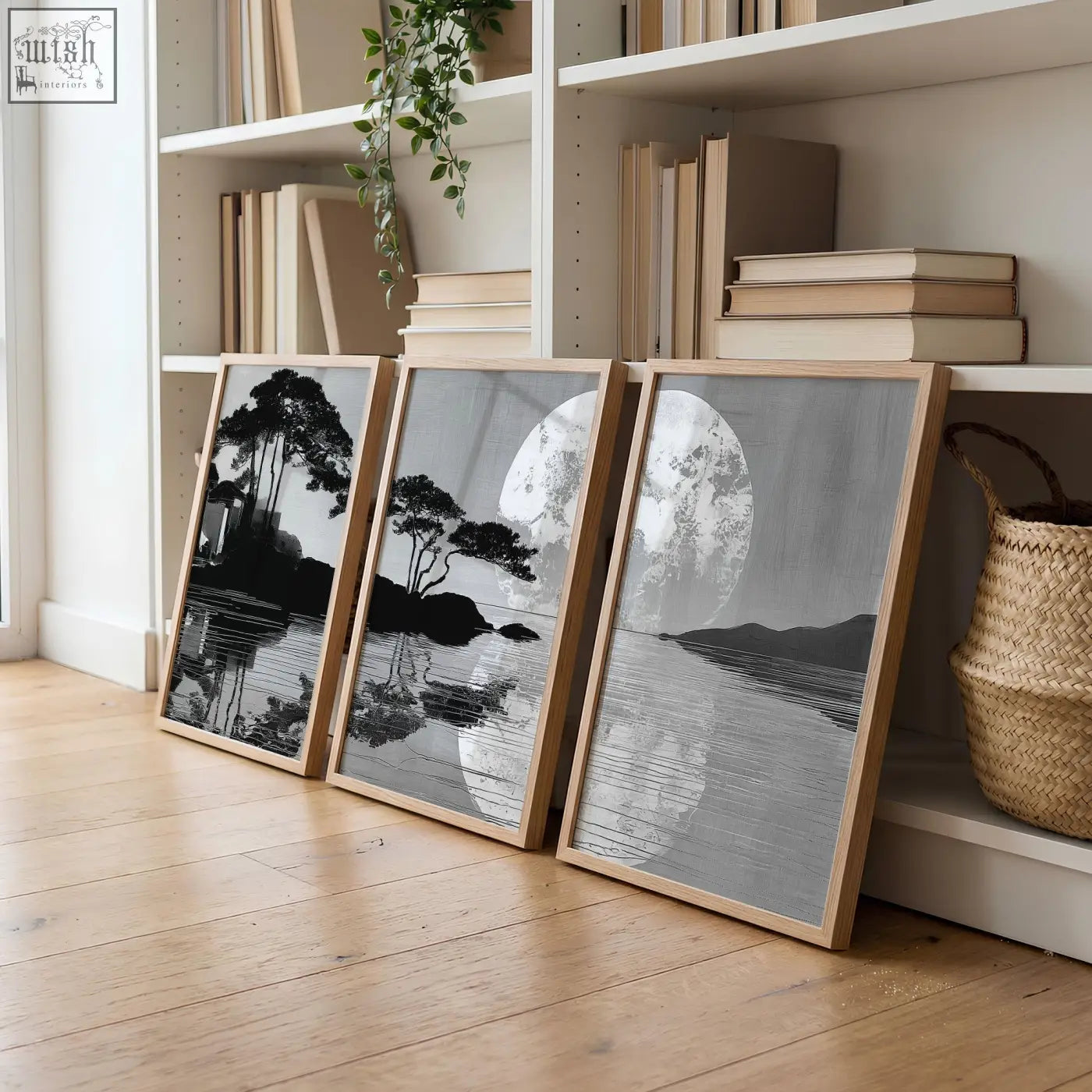 Three framed black and white large art living room prints with minimalist wooden frames showing japanese moonrise silhouettes
