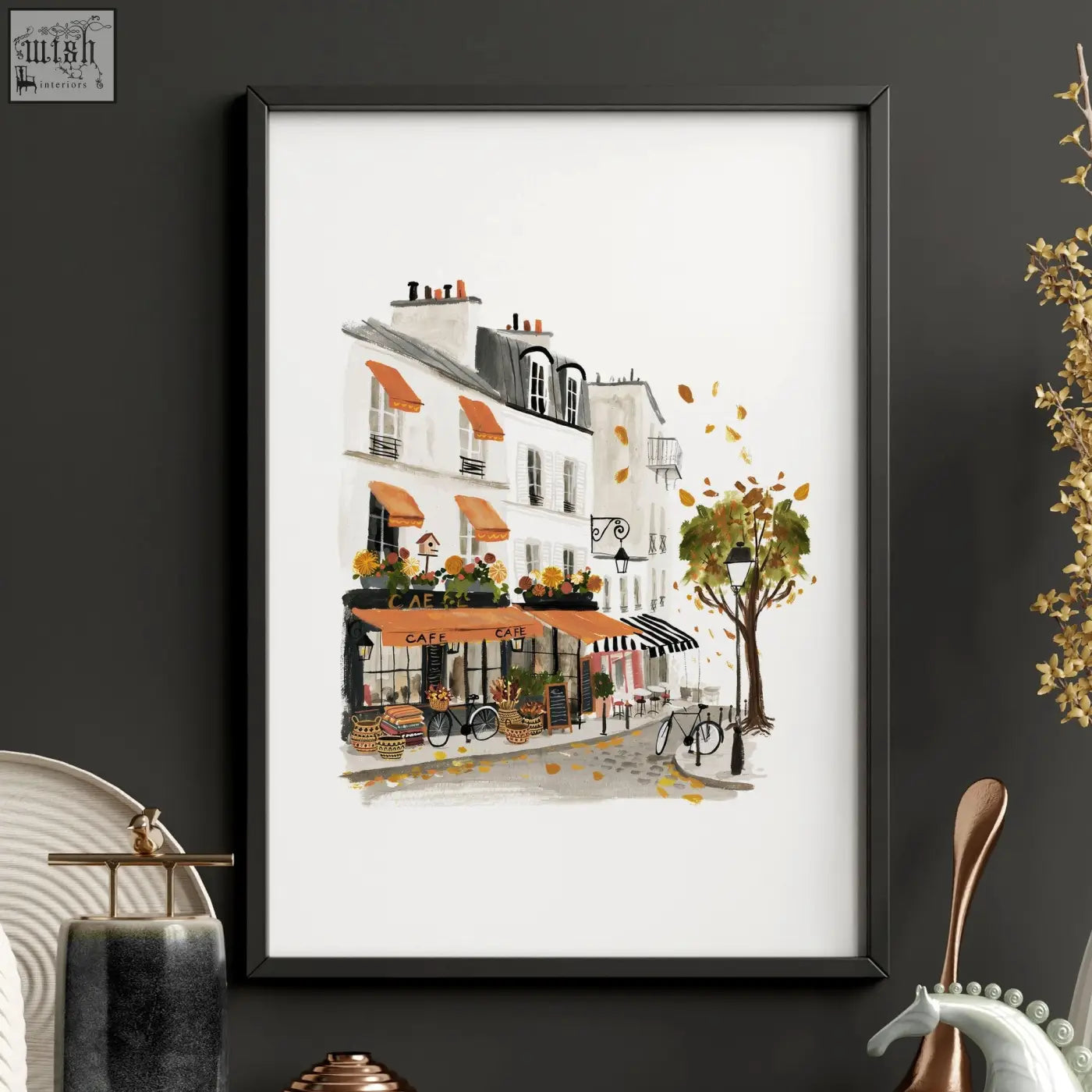 Black-framed large artwork for living room showing autumn paris watercolour with white buildings orange awnings and leaves