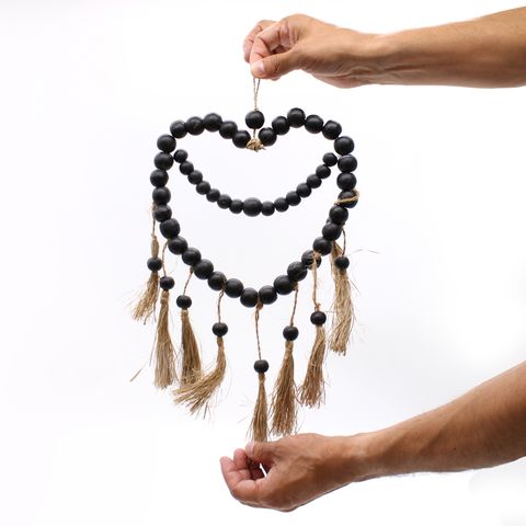 Large bead heart mobil decoration with black wooden beads and natural jute tassels measuring 33x23cm