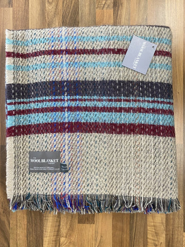 Large checked random recycled wool blanket with horizontal beige, blue, red, and navy stripes and fringed edge