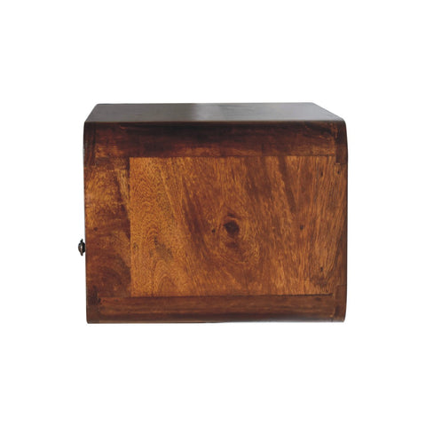 A large chestnut curve upper slot floating bedside table with a rustic wooden bread box design and warm brown finish