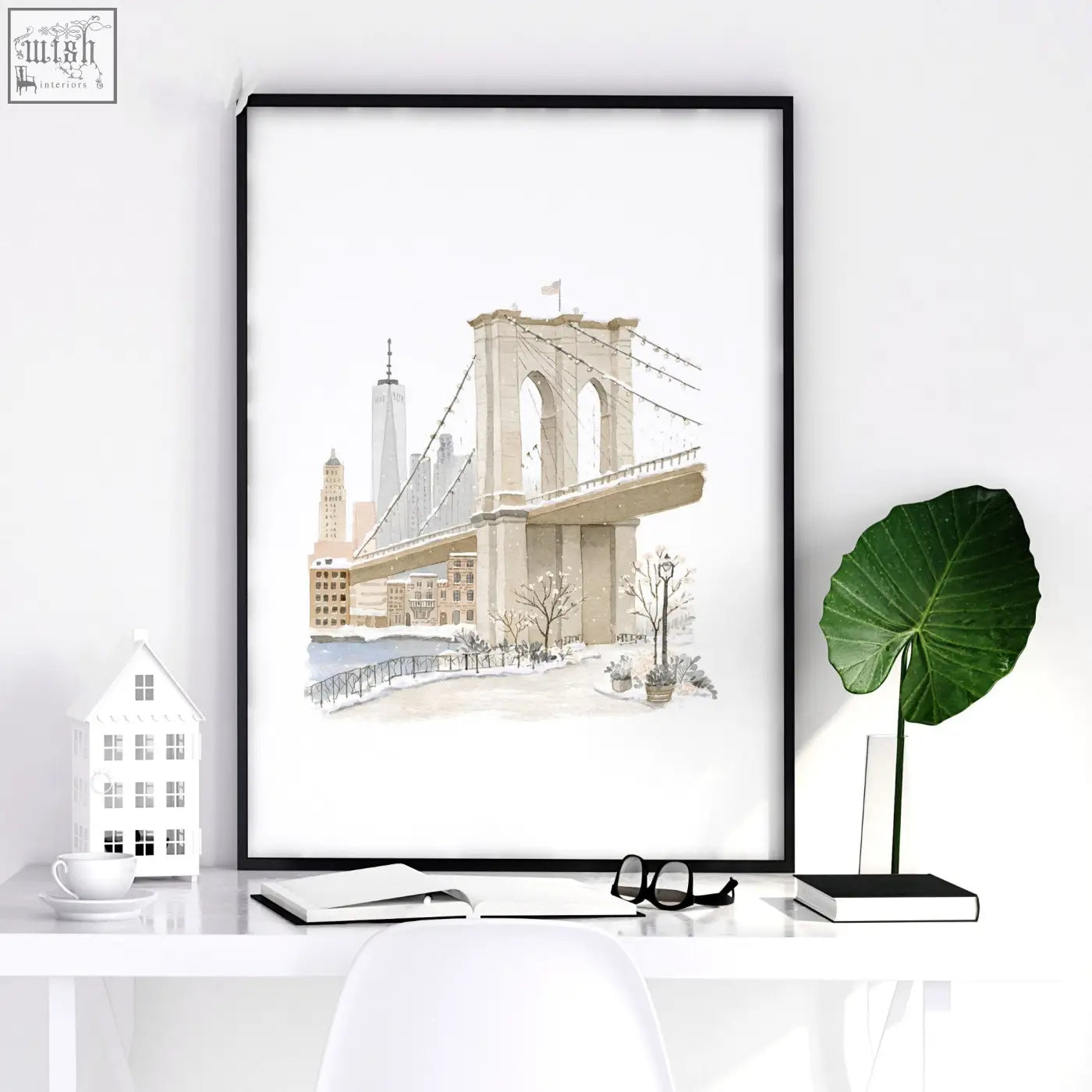 Black-framed large dining room wall art featuring a beige pastel watercolor print of brooklyn bridge winter scene